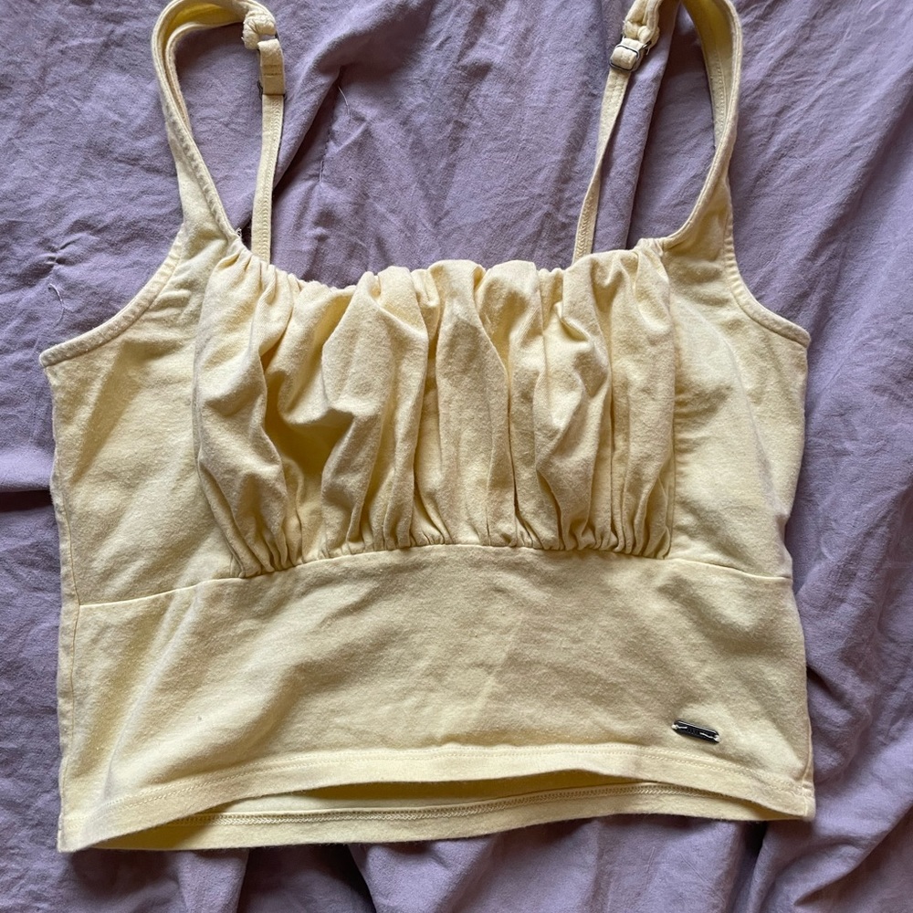 Hollister light yellow crop top.  Super soft, fits like a small but says M.